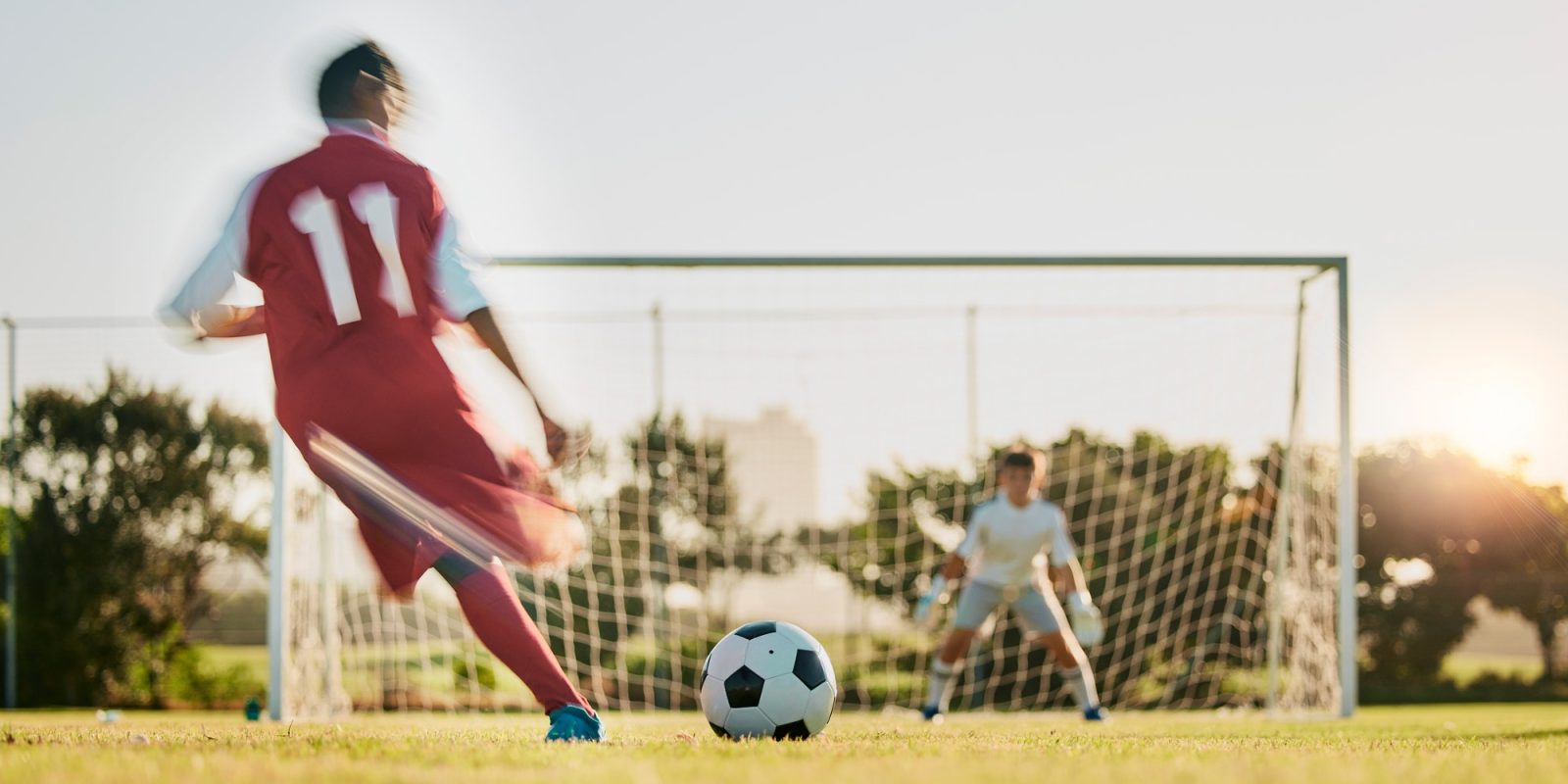 Soccer, goal post and ball, soccer player running and kicking to score goals, motivation on grass s